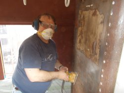  Dave Cook sanding bulkhead wall at East end  of coach  DSCN0827