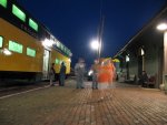 Passengers board the last scoot into the city for the night