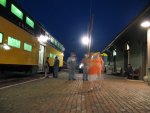 Passengers board the last scoot into the city for the night