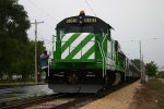 The conductor steps down from the BN5383 on a rainy day