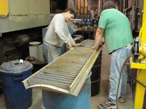 Dan and Brad sanding a dynamic brake louver 