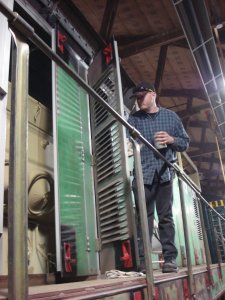 Warren wipes down engine room doors for primer