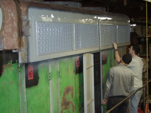 Charlie, Warren and Roger installing the firemans side shutters.