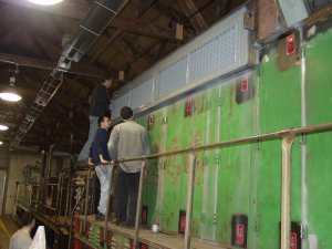 Jamie, Kyle, Roger and Warren installing the engineers side shutters.