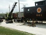 05.01.05 - THE TRACK DEPARTMENT IS USING A CRANE TO HELP DISASSEMBLE A TRUCK TO CHANGE THE WHEELSET.