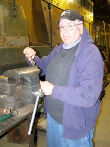 Roger works on using a dye to clean up the bolts for the HEP cooling hatch.