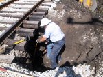 After moving a lot of material with the backhoe, Dave and Jerry taking a turn at digging around the concrete culvert by hand to locate the breach.