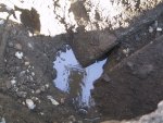 Finally deep enough to see that the two sections of culvert were never properly fitted when installed back in the early 80's.  You can also see where the breach was allowing the earth above to wash away into the culvert.