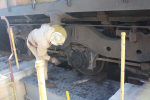 Roger B. Checks the the top of the box on the firemans side to make sure the springs seat properly as the combo is raised.