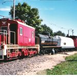 07.10.04 - THE CAR IS BWEING LETTERED BY BOB KUTELLA.  IT SITS IN A TRAIN OF CARS RESTORED THIS YEAR BY THE FREIGHT CAR DEPARTMENT.