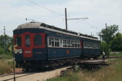 A 2-car CA&E train led by 309 gets ready for service (07/2002).