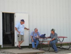 08/11/07 Nick Kallas looks on while Bob Hunter and Bob Kutella discuss primer