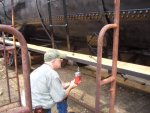 07.27.08 - RAY MORANN IS DRILLING HOLES TO APPLY TIMBER BOLTS TO HOLD THE RUNNING BOARD IN PLACE.