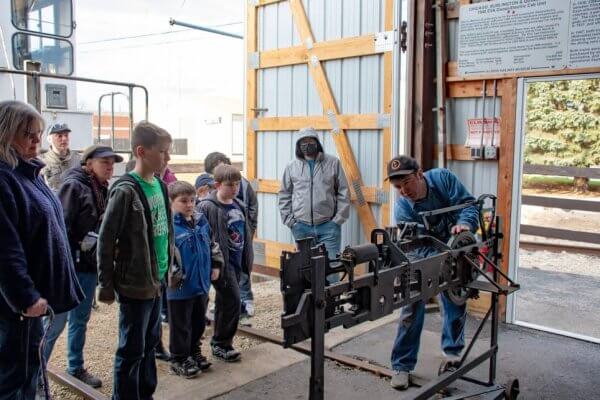 School group of kids at IRM learning about steam locomotives