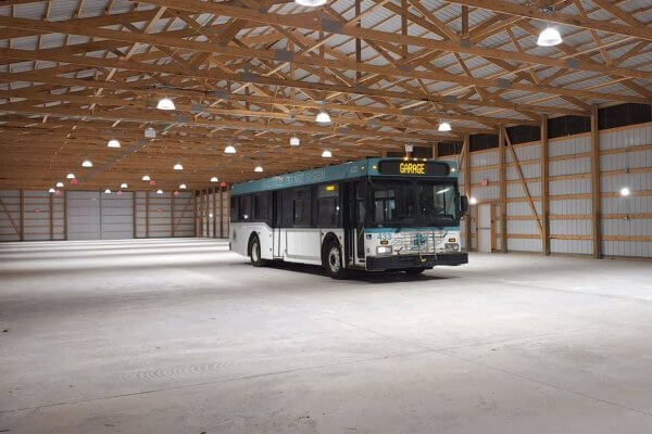 Interior of the new Bob Bourne Transit Building at the Illinois Railway Museum with a Janesville bus inside the building.